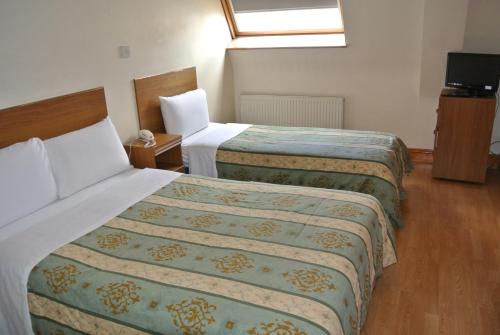 Üç Kişilik Oda - En-Suite Banyolu