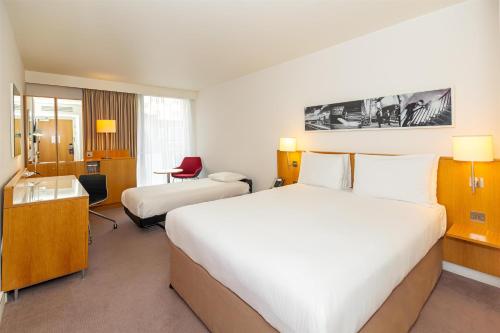 Queen Room with One Single Roll-Away Bed