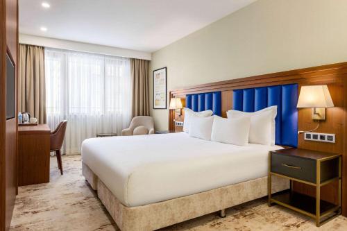 Deluxe King Room with Balcony and City View