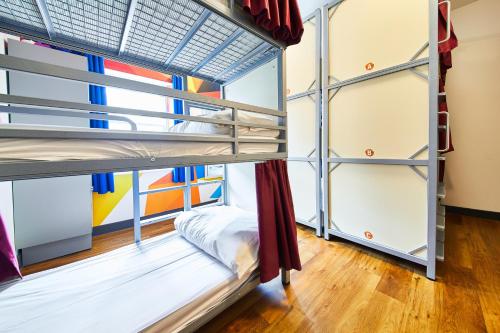 Bed in 9-Bed Mixed Dormitory Room with Triple Bunks and External Shared Bathroom