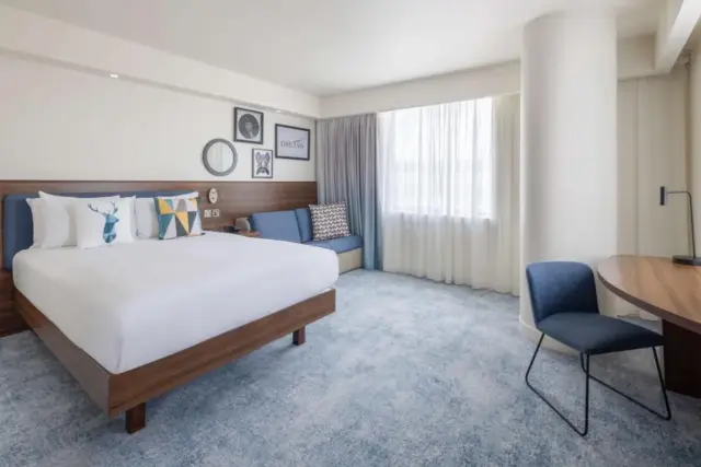 Corner Queen Room with Sofa Bed